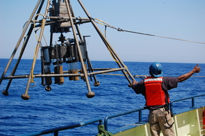 The multicorer device being lowered into the ocean takes eight one-foot cores from the seafloor. Scientists analyze such cores for clues to the climate of the past several thousand years. (Photo: Peter deMenocal) The multicorer device being lowered into the ocean takes eight one-foot cores from the seafloor. Scientists analyze such cores for clues to the climate of the past several thousand years. (Photo: Peter deMenocal)
